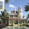 Florida's Historic Victorian Homes by Schiffer Publishing, Ltd. features a grand red-roofed Florida Victorian with a tower and wraparound porch, a palm-lined pool, and a close-up inset highlighting ornate Victorian gable details.