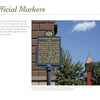 The book "Signs of Lancaster County" by Schiffer Publishing, Ltd. explores historical markers like one set near bushes before a red brick building, detailing Lancaster County's founding and its place in Amish Country.
