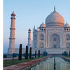 A front view of the Taj Mahal in Agra, India, is shown on the cover of Monumental by Schiffer Publishing, Ltd., featuring the marble mausoleum reflected in a pool, trimmed hedges, and a clear sky, with text about the site on the left.